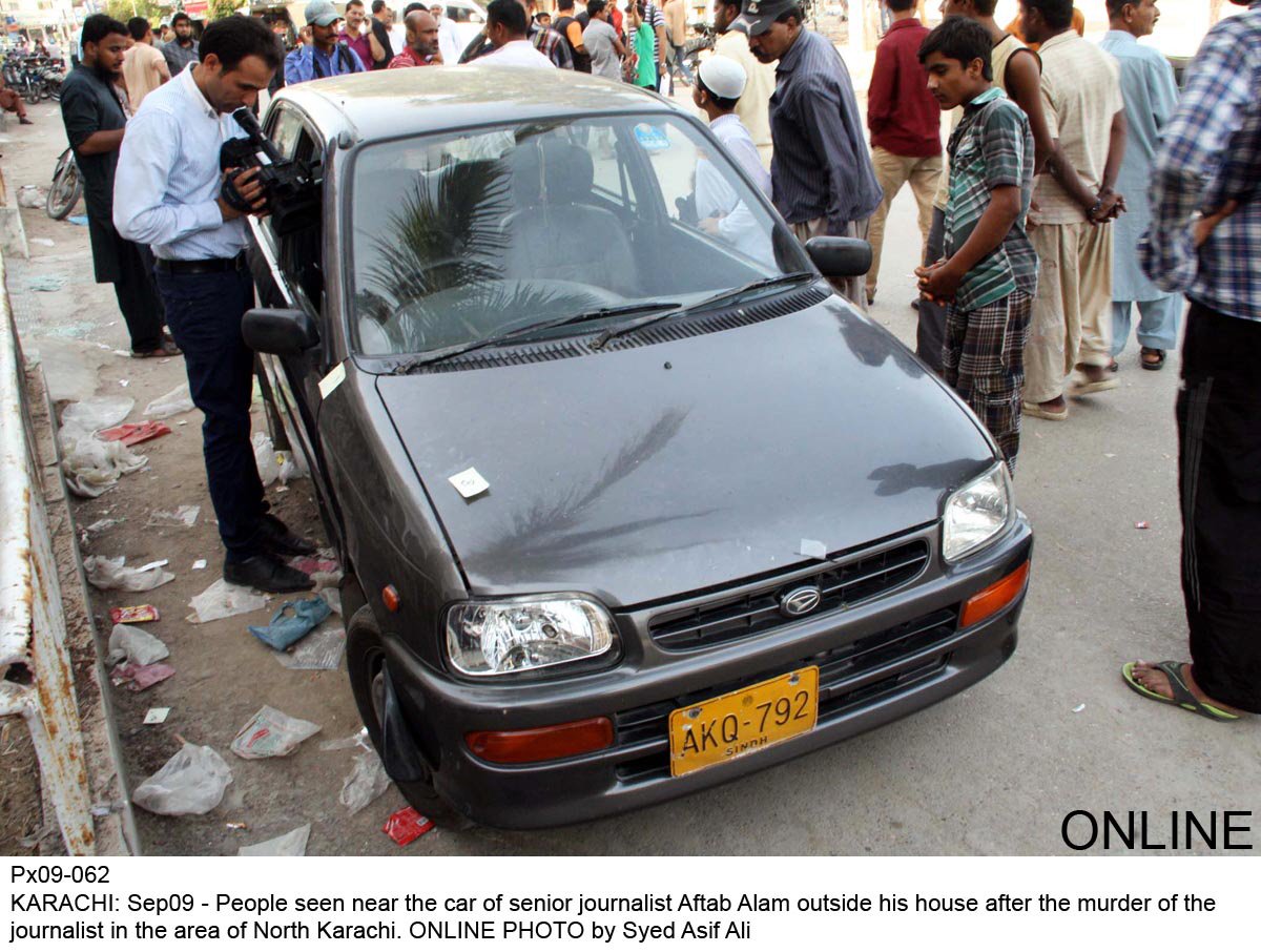 people gather outside journalist aftab alam 039 s car after his murder in north karachi on september 9 2015 photo online