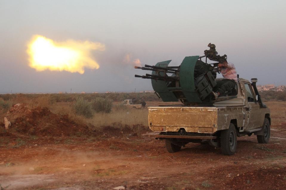 rebel fighters clash with syrian pro government forces near deir al zoghb in idlib province on august 31 2015 photo afp