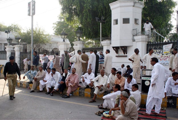 member of all pakistan clerks association blocked the road as they were demonstrating for their demands photo ppi