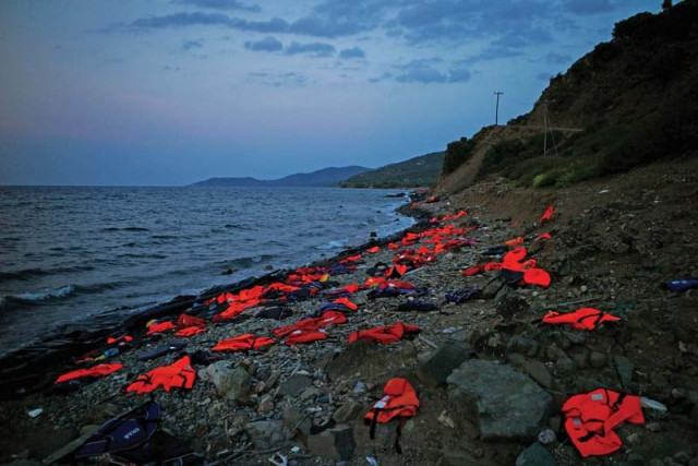 a view of the greek island of lesbos shows life vests left on the shore by incoming refugees photo afp a view of the greek island of lesbos shows life vests left on the shore by incoming refugees photo afp