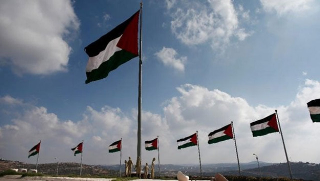 palestinian flags flutter on a square in the city of rawabi just north of ramallah in the west bank on september 5 2014 photo afp palestinian flags flutter on a square in the city of rawabi just north of ramallah in the west bank on september 5 2014 photo afp