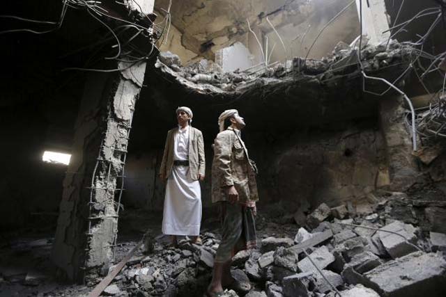 houthi militants stand in the house of houthi leader yahya aiydh after saudi led air strikes destroyed it in yemen 039 s capital sanaa september 8 2015 photo reuters