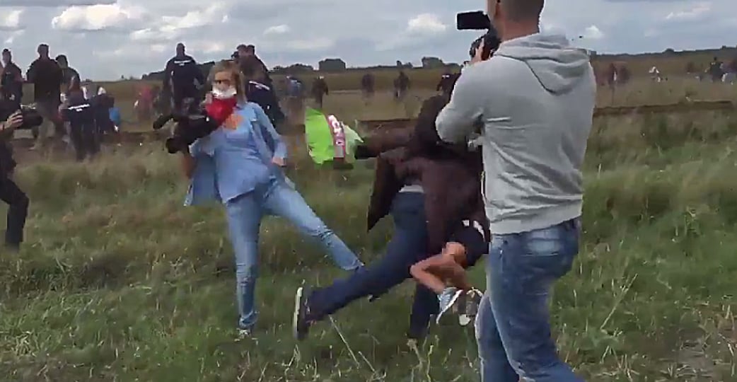 photojournalist petra laszlo trips a refugee who was carrying a child as they broke a police line