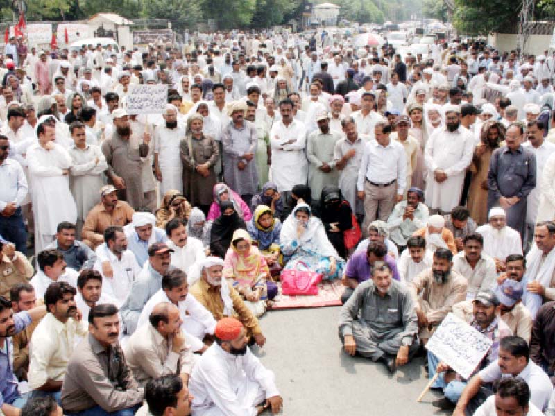 the protesters stage a sit in at edgerton road to press the government to stop privatisation phoito abid nawaz express