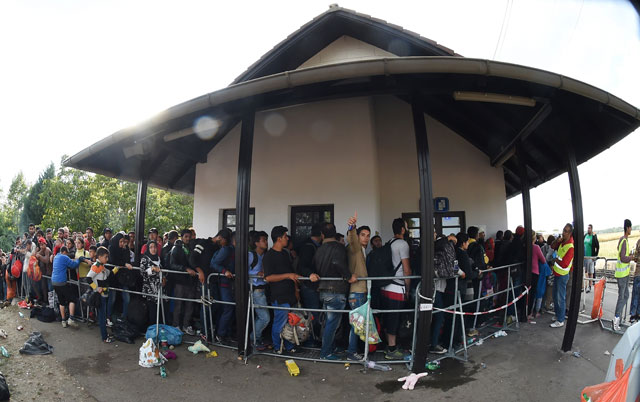 migrants are waiting to board a bus at the train station in nickelsdorf austria near the hungarian austrian border on september 10 2015 since the beginning of 2015 photo afp