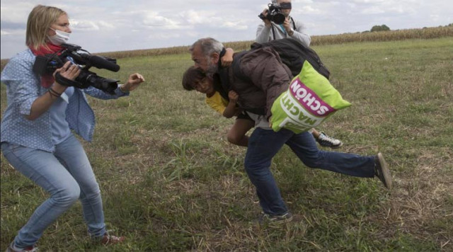 the camerawoman working for a hungarian tv news channel was reportedly fired after the video went viral photo reuters the camerawoman working for a hungarian tv news channel was reportedly fired after the video went viral photo reuters