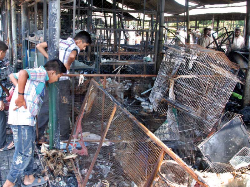 passers by inspect the debris at the site photo riaz ahmed express