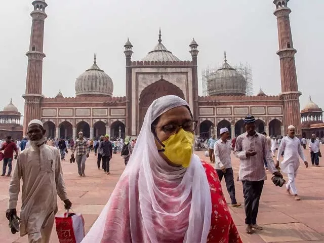 a indian muslim woman wearing a protective mask leaves after attending congregational friday prayers at the historic jama masjid photo afp a indian muslim woman wearing a protective mask leaves after attending congregational friday prayers at the historic jama masjid photo afp