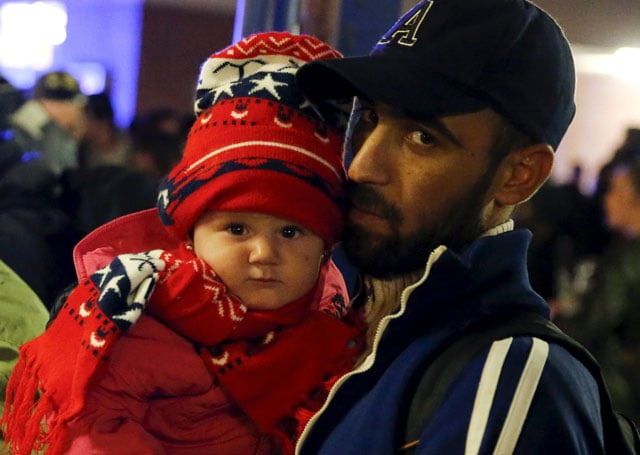migrants from syria wait to board buses to be transported to a berlin refugee camp after they arrived by train from austria to schoenefeld railway station south of berlin germany september 11 2015 photo reuters migrants from syria wait to board buses to be transported to a berlin refugee camp after they arrived by train from austria to schoenefeld railway station south of berlin germany september 11 2015 photo reuters