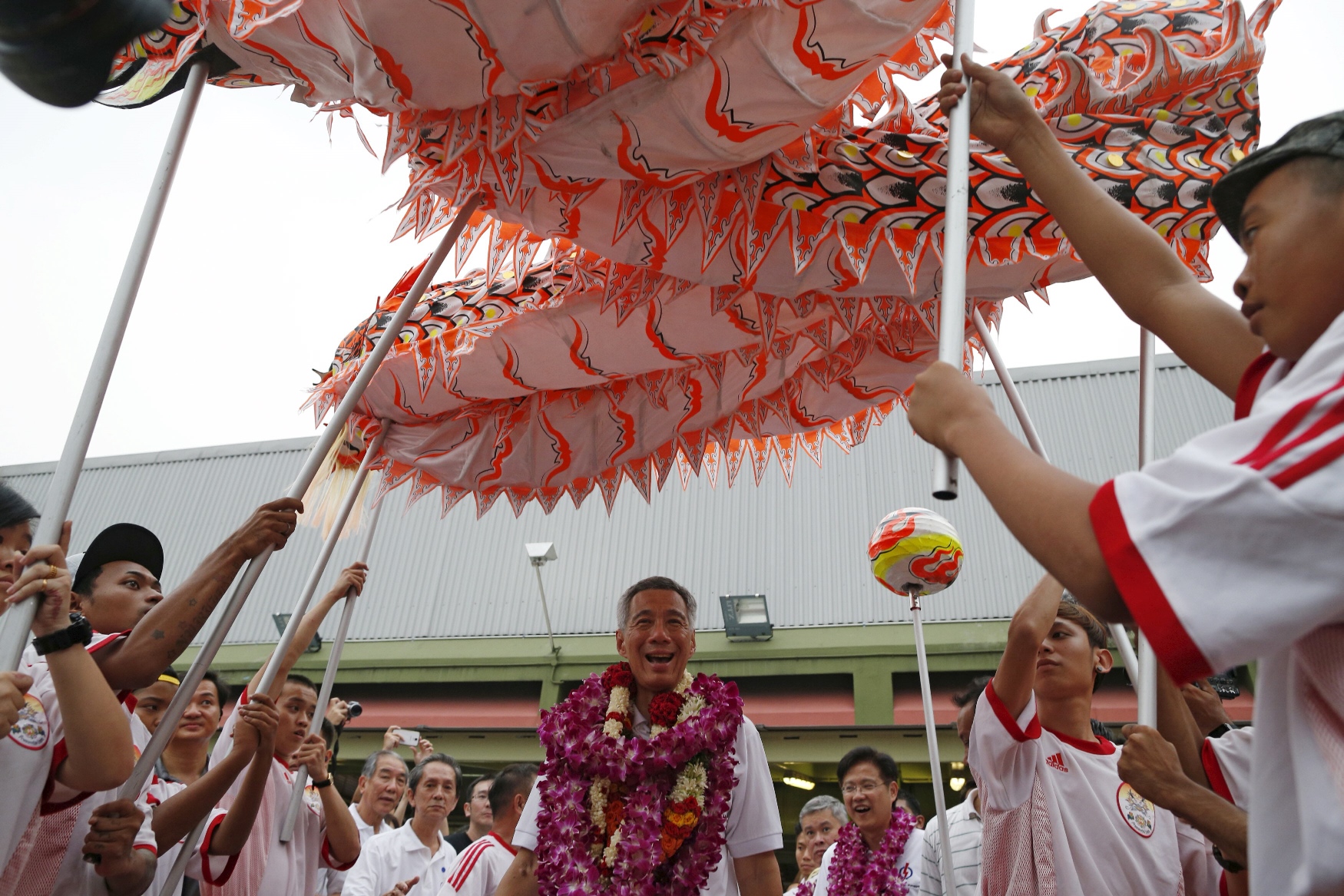 singapore 039 s prime minister and secretary general of the people 039 s action party pap lee hsien loong c is greeted by a dragon dance as he thanks supporters after the general election in singapore september 12 2015 photo reuters