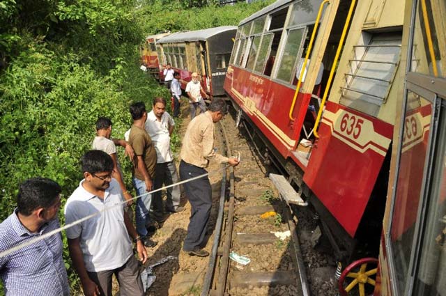 people at the site of the derailment of a train on the kalka shimla unesco heritage track on september 12 2015 photo afp