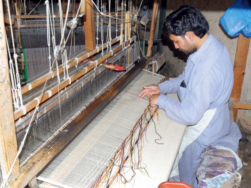 the products on display include chitrali pakols afghani carpets shawls from charsadda and embroidered cloth photos express