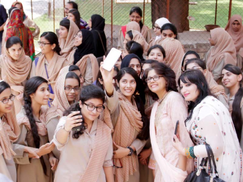 position holder students take photographs on saturday at alhamra hall photo abid nawaz