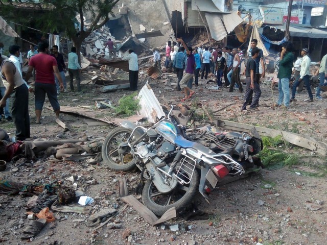 people gather around the site of an explosion at a restaurant in jhabua district in the central indian state of madhya pradesh on september 12 2015 photo afp