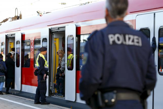 migrants enter a regional train at the main railway station in munich germany september 13 2015 photo reuters