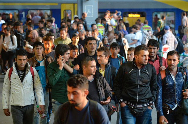migrants arrive at the railway station in munich southern germany on september 12 2015 photo afp