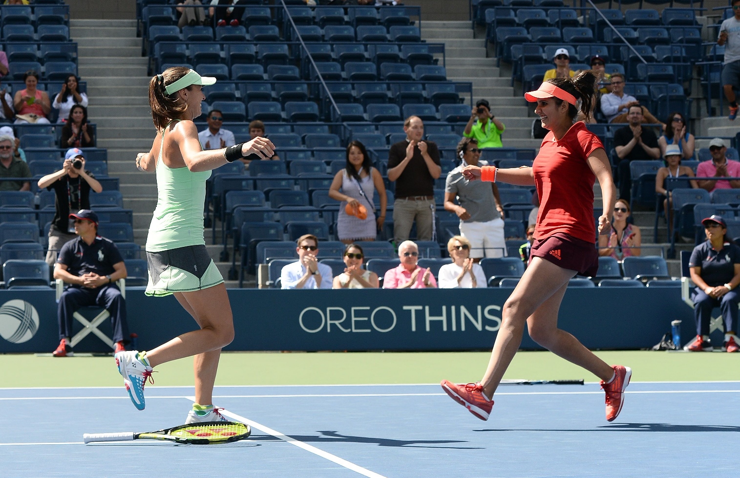 sania mirza r of india and her teammate martina hingis of switzerland celebrate winning their 2015 us open women 039 s double final match against casey dellacqua of australia and yaroslava shvedova of kazakhstan at the usta billie jean king national tennis center in new york on september 13 2015 photo afp