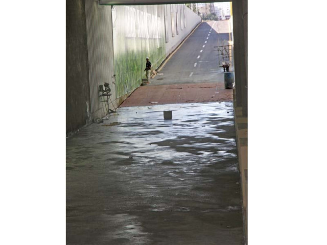 a week after its inauguration one of the tracks of mehran underpass was closed apparently due to seepage a large pool of water stands on the closed track photo athar khan express a week after its inauguration one of the tracks of mehran underpass was closed apparently due to seepage a large pool of water stands on the closed track photo athar khan express