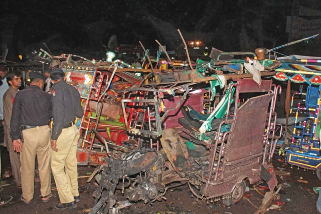 policemen inspect the site of an ied explosion in multan photo express policemen inspect the site of an ied explosion in multan photo express