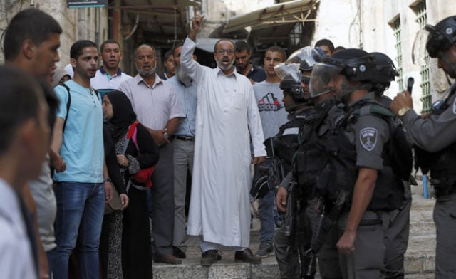 palestinians shout slogans in front of israeli security forces who block a road leading to the al aqsa mosque compound in jerusalem 039 s old city on september 13 2015 palestinians clashed with israeli police at al aqsa mosque compound just hours before the start of the jewish new year photo afp palestinians shout slogans in front of israeli security forces who block a road leading to the al aqsa mosque compound in jerusalem 039 s old city on september 13 2015 palestinians clashed with israeli police at al aqsa mosque compound just hours before the start of the jewish new year photo afp