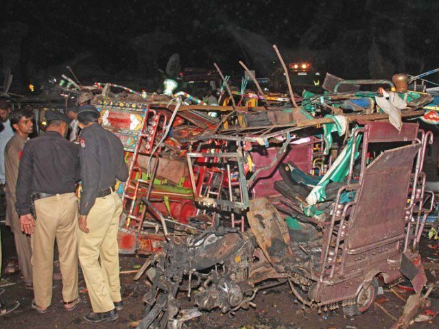 policemen inspect the site of an ied explosion in multan photo express