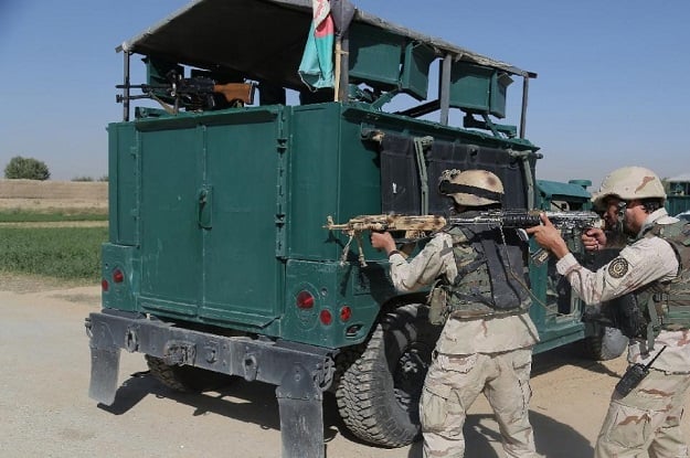 afghan security forces take position near the main prison building after a militant attack in ghazni on september 14 2015 photo afp