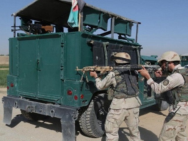 afghan security forces take position near the main prison building after a militant attack in ghazni on september 14 2015 photo afp