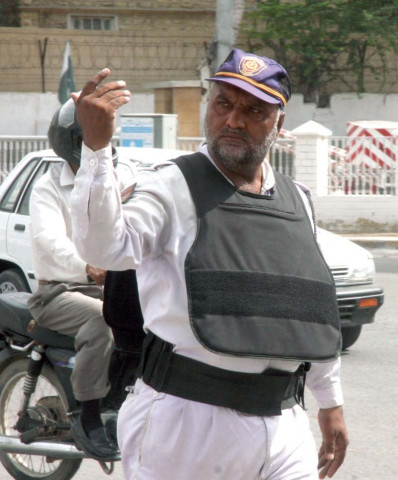self defense a traffic police official wears a bulletproof jacket to protect himself in the wake of five attacks on his colleagues in recent weeks photo athar khan express self defense a traffic police official wears a bulletproof jacket to protect himself in the wake of five attacks on his colleagues in recent weeks photo athar khan express