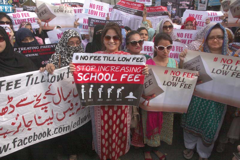 parents protest outside karachi press club on tuesday against the hefty increase in school fees by private schools and demand a monitoring body be set up to inspect such hikes photo athar khan express