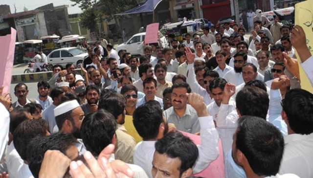 the employees reached the mardan press club at around 12 30pm holding placards and banners inscribed with slogans in favour of the vc photo online the employees reached the mardan press club at around 12 30pm holding placards and banners inscribed with slogans in favour of the vc photo online