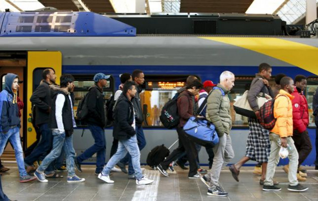 migrants arrive at main railway station in munich germany september 13 2015 photo reuters migrants arrive at main railway station in munich germany september 13 2015 photo reuters
