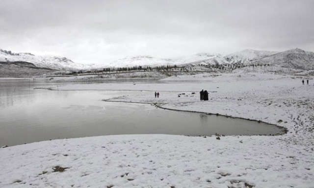 a general view of people visiting the snow covered hanna lake after a snowfall photo reuters