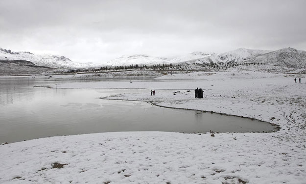a general view of people visiting the snow covered hanna lake after a snowfall photo reuters