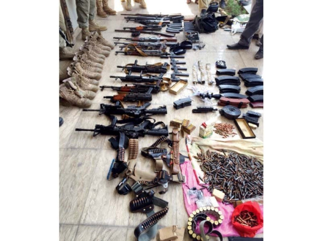 weapons including automatic rifles recovered from the raid photo express weapons including automatic rifles recovered from the raid photo express