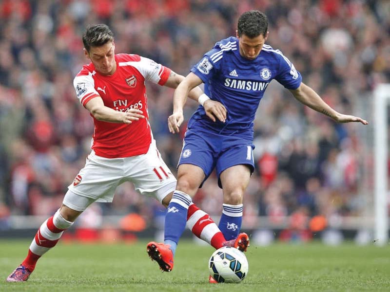 ozil and hazard will both be looking to open up the opposition defences in what is expected to be a toughly contested match at stamford bridge photo afp