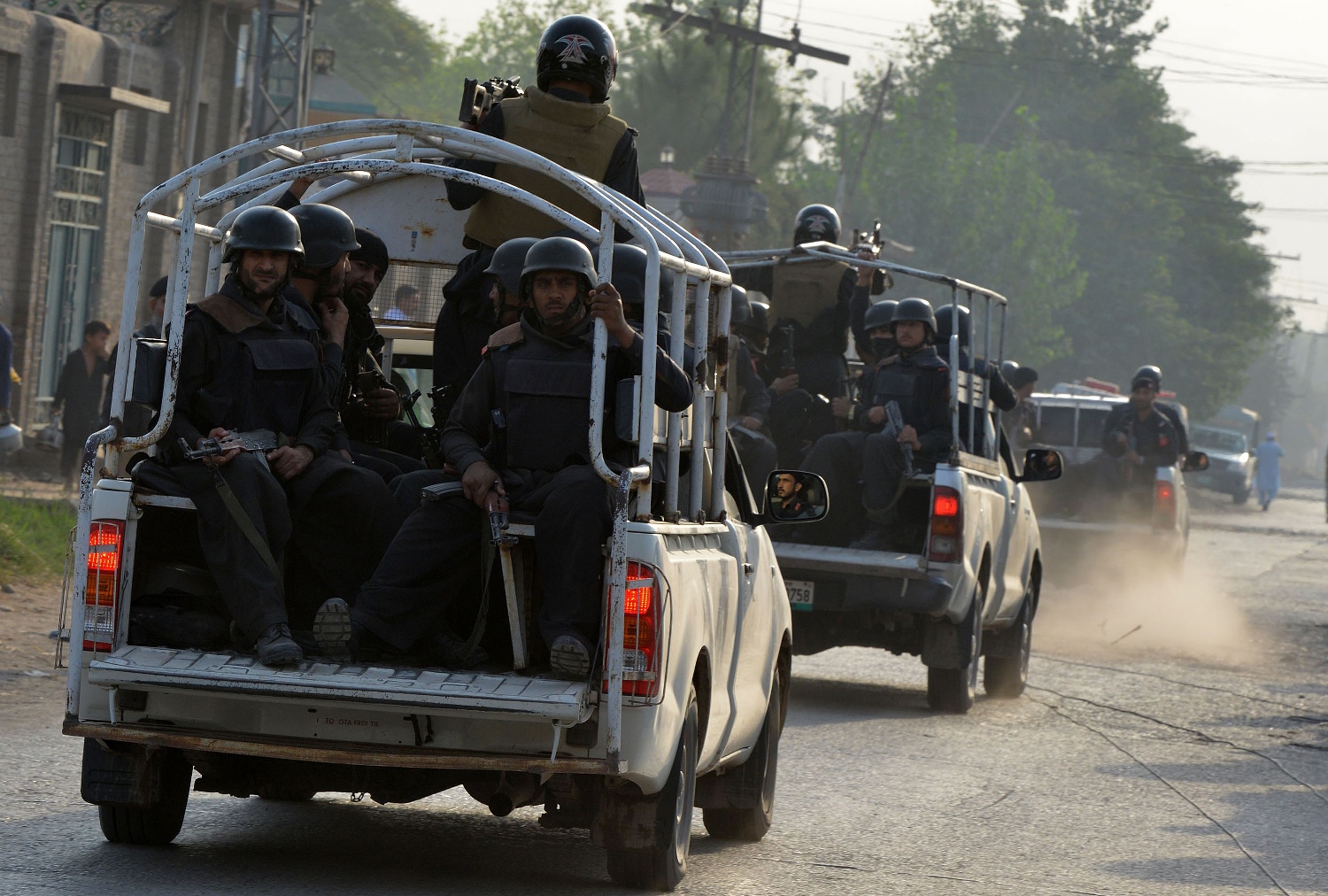 paramilitary soldiers arrive to take position outside the pakistan air force base after an attack by militants in peshawar on september 18 2015 photo afp