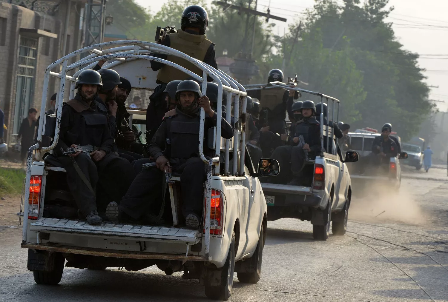 paramilitary soldiers arrive to take position outside the pakistan air force base after an attack by militants in peshawar on september 18 2015 photo afp paramilitary soldiers arrive to take position outside the pakistan air force base after an attack by militants in peshawar on september 18 2015 photo afp