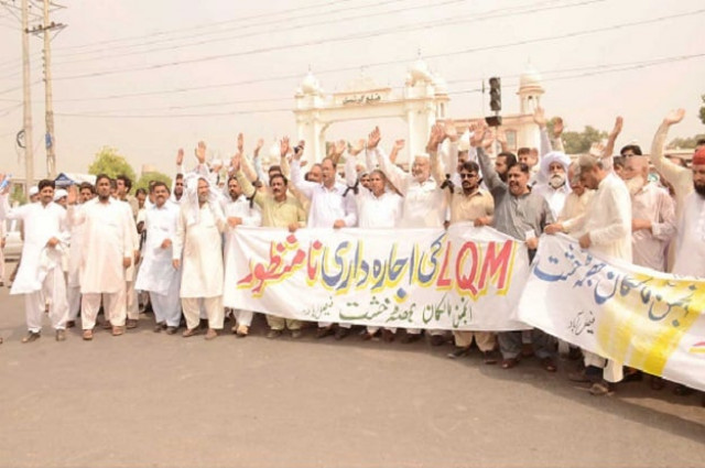 the protesters were holding banners and placards bearing slogans against the labour department the district government and workers unions photo nni the protesters were holding banners and placards bearing slogans against the labour department the district government and workers unions photo nni