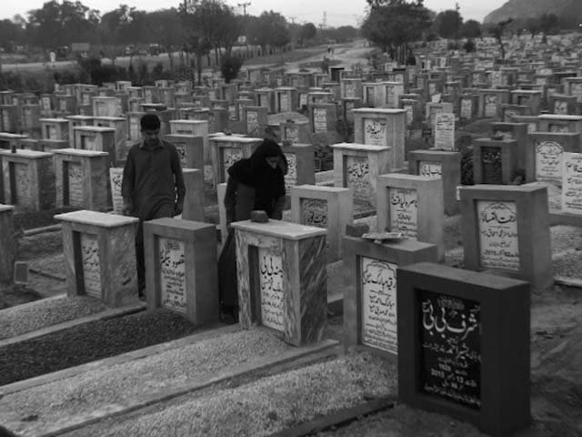 residents belonging to the ahmadi sect visit a cemetery at rabwah photo afp