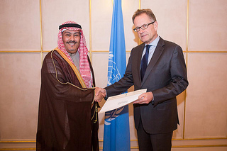 h e faisal bin hassan trad presents his credentials to michael m ller right the acting director general of the united nations office at geneva january 7 2014 photo un