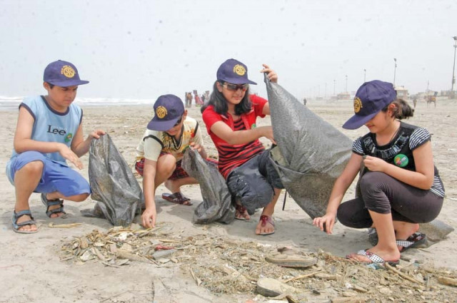 volunteers clean up the clifton beach by picking up garbage littered all over the place around 50 5 per cent of this waste is plastic material which is harmful to marine life photo file volunteers clean up the clifton beach by picking up garbage littered all over the place around 50 5 per cent of this waste is plastic material which is harmful to marine life photo file