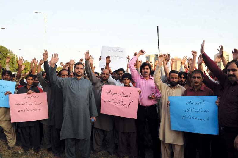 traders from melody food park protest at the national press club against the ict administration s campaign photo waseem nazir express