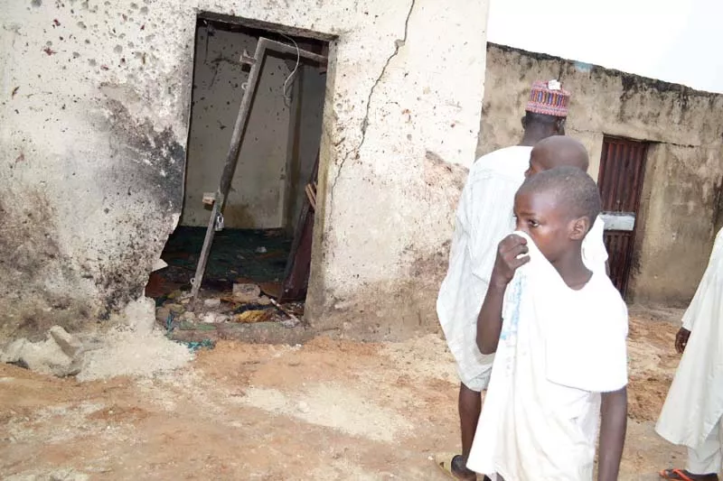 a child covers his nose inside a mosque where a suicide bomber killed over 20 worshippers in maiduguri on monday photo afp a child covers his nose inside a mosque where a suicide bomber killed over 20 worshippers in maiduguri on monday photo afp