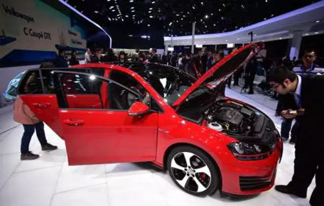 journalists checkout a vw golf gti car on display at the 16th shanghai international automobile industry exhibition on april 20 2015 photo afp journalists checkout a vw golf gti car on display at the 16th shanghai international automobile industry exhibition on april 20 2015 photo afp