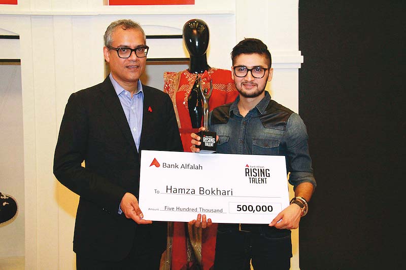 hamza receiving cash prize worth rs0 5 million for the ruzzkiy kukly range photo publicity