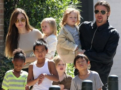 angelina jolie and brad pitt are reportedly adopting a syrian refugee