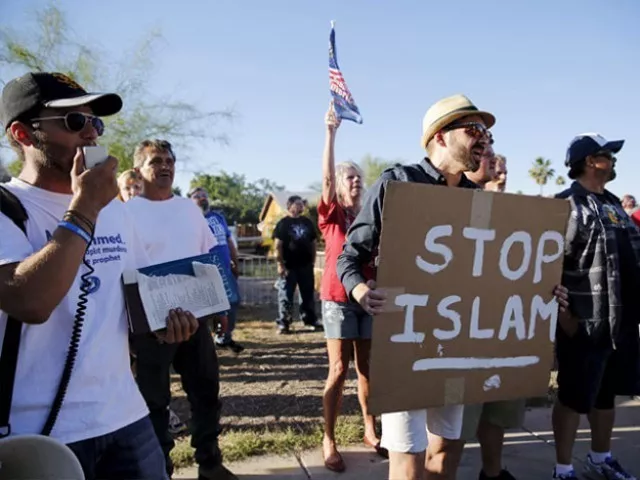 a demonstrator shouts and carries a stop islam sign during a freedom of speech rally round ii outside the islamic community center of phoenix arizona on may 29 2015 photo reuters a demonstrator shouts and carries a stop islam sign during a freedom of speech rally round ii outside the islamic community center of phoenix arizona on may 29 2015 photo reuters