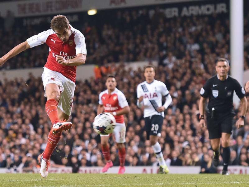 flamini s lashed a sumptuous volley into the bottom corner from 20 yards for his second goal of the match to settle the first north london derby of the season photo afp