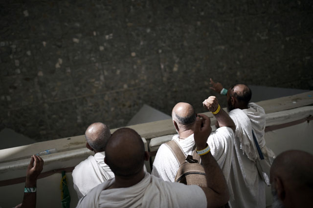 muslim pilgrims throw pebbles at pillars during the quot jamarat quot ritual the stoning of satan in mina near the holy city of makkah on september 24 2015 photo afp