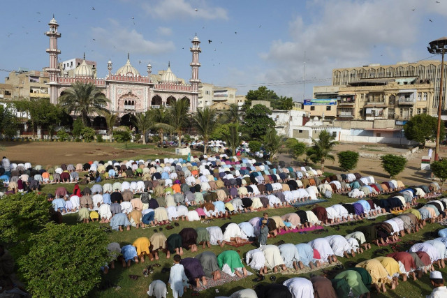 devotees offer eidul azha prayers outside a mosque in karachi on september 25 2015 photo afp devotees offer eidul azha prayers outside a mosque in karachi on september 25 2015 photo afp